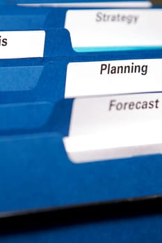 Filing cabinet full of business folders and documents