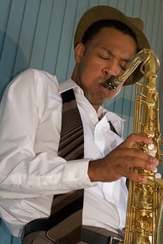 An youung and trendy African-American sax musician