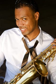 An youung and trendy African-American sax musician