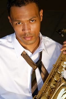 An youung and trendy African-American sax musician