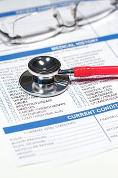 Close up of a Medical History form and a doctor&#039 s Stethoscope