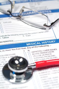 Close up of a Medical History form and a doctor&#039 s Stethoscope