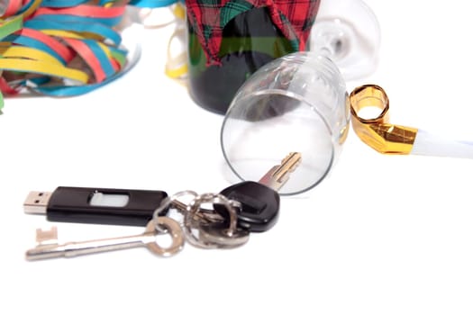 whiskey with keys inside fallen glass on white background depicting drunk driving and addictions can kill