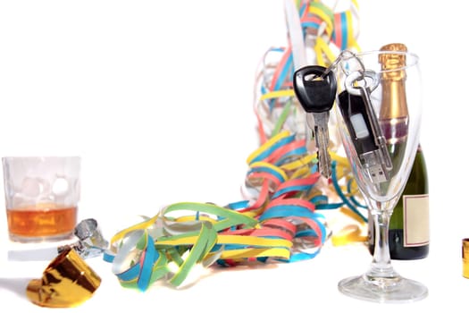 champagne glass and whiskey with keys in glass on white background depicting drunk driving and addictions can kill