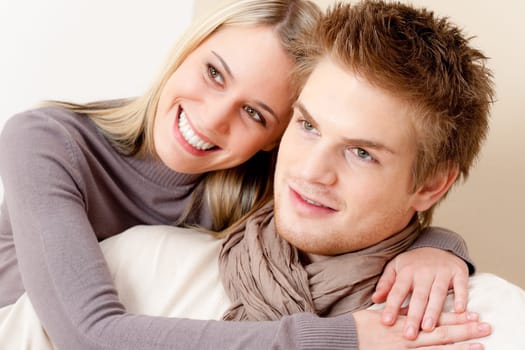 Couple in love - happy relax at home together in living room