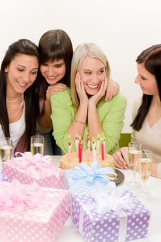 Birthday party - group of woman celebrate with cake and champagne
