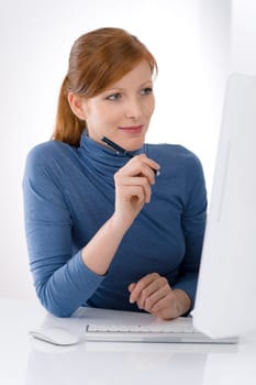 Modern office - young business woman work at computer