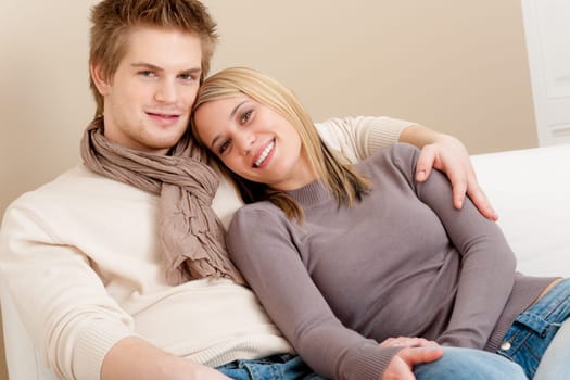Couple in love - happy relax at home together in living room