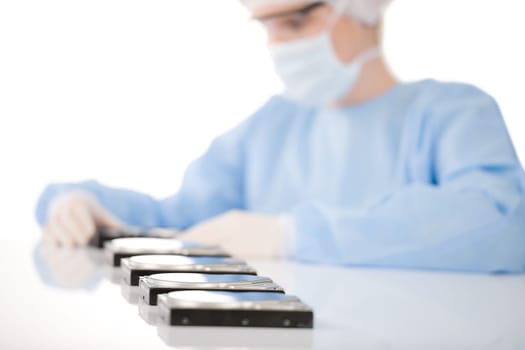 Female computer engineer repair hard disc defect, experiment in sterile laboratory