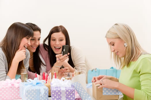 Birthday party - cheerful woman take photo with camera celebrating