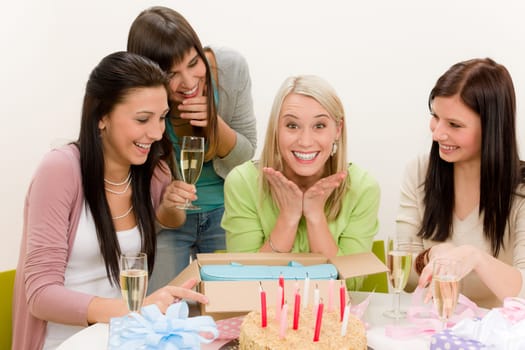 Birthday party - group of woman celebrate with cake and champagne