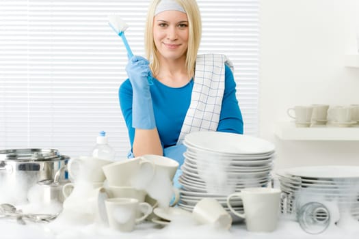Modern kitchen - happy woman washing dishes, housework