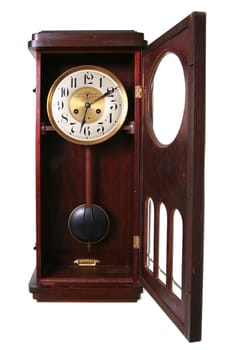 clock, old vintage time piece in wood and brass showing just past twelve or midnight isolated on white