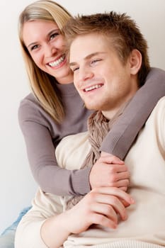 Couple in love - happy relax at home together in living room