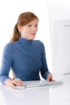 Modern office - young business woman work at computer