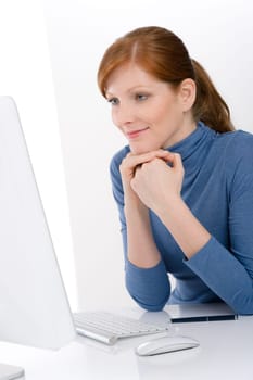 Modern office - young business woman work at computer