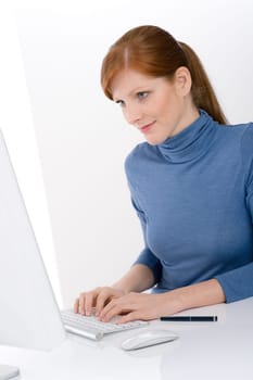 Modern office - young business woman work at computer