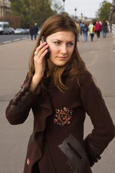 Young woman speaking on mobile phone
