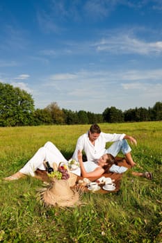 Picnic - Romantic couple in spring nature on sunny day
