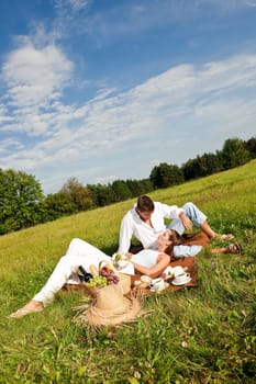 Picnic - Romantic couple in spring nature on sunny day