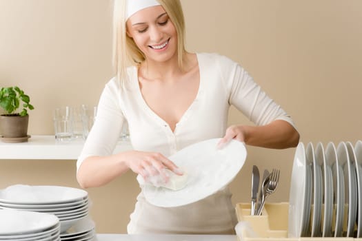 Modern kitchen - happy woman washing dishes, housework