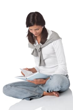 Brown hair teenager holding book on white background