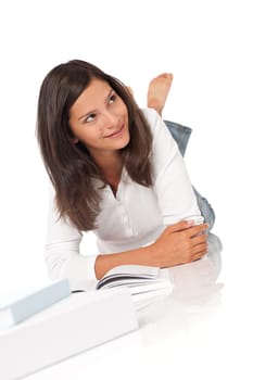 Smiling teenager with books on white background