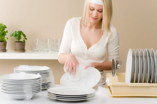Modern kitchen - happy woman washing dishes, housework