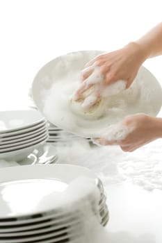 Washing dishes - hands with gloves in kitchen, housework