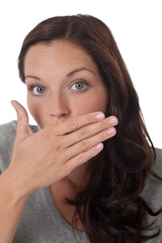 Surprised young woman on white background