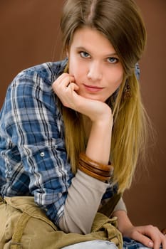 Fashion model - young woman posing in country style clothes
