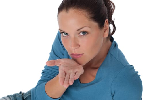 Brown hair woman blowing a kiss on white background