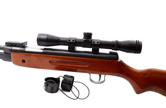 Rifle with optical sight on white