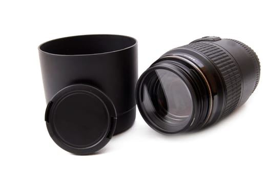 Camera lense, lense hood and lense cap on white background