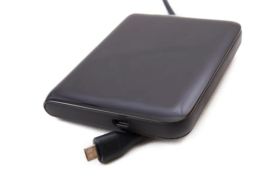 Portable external HDD hard disk drive with USB cable on white background