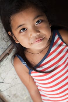 Asian girl portrait - Filipina against wall in natural light