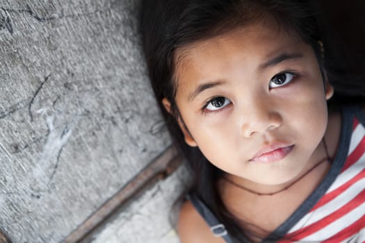 Young Asian girl portrait against grungy wall - Manila Philippines - natural light
