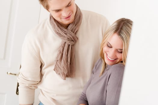 Couple in love - happy relax at home together in living room