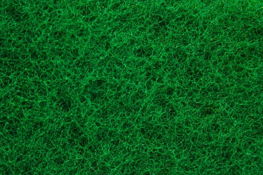 Green abrasive sponge texture background like grass