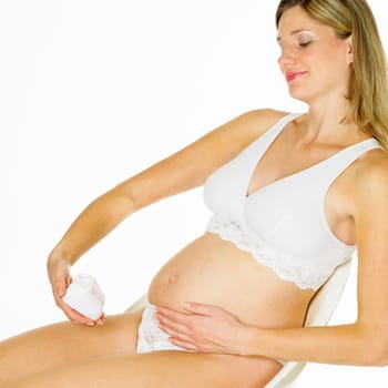pregnat woman with shoes for babies