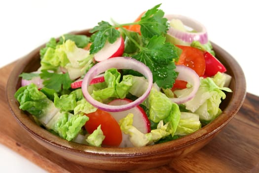 mixed salad with lettuce hearts,tomato and radishes