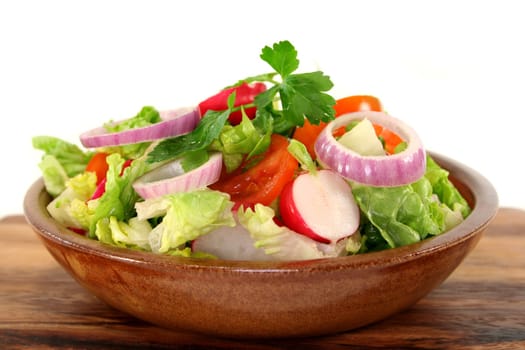 mixed salad with lettuce hearts,tomato and radishes