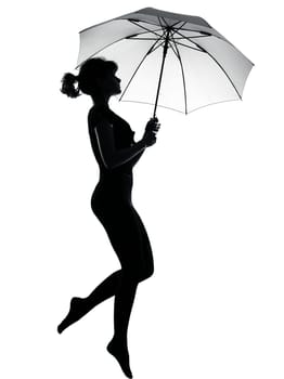 silhouette woman flying  holding open umbrella