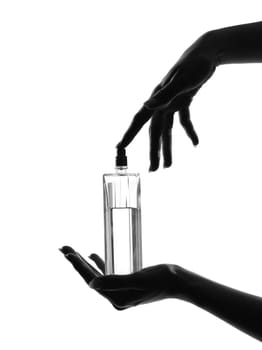 detail close-up silhouette woman hands with perfume