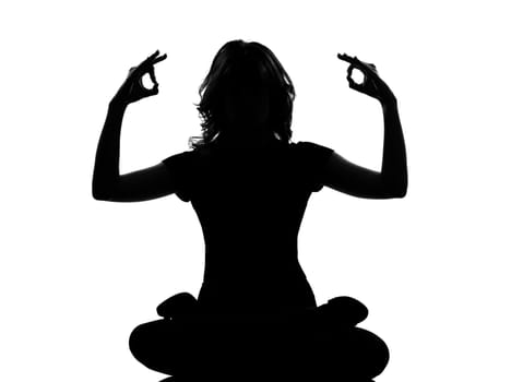 silhouette woman sitting exercising yoga