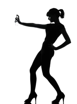 silhouette woman spraying perfume