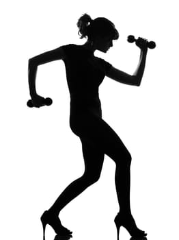 silhouette woman workout body building with dumbells