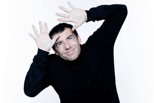 man afraid shielding protecting his head