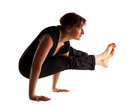 Mature woman stand on hands  in yoga pose isolated