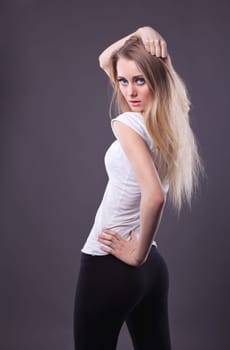 Young blond girl in dance look at camera